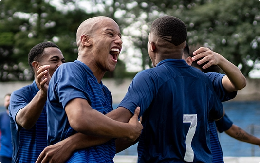 Football teammates celebrating together